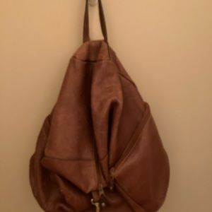 Leather backpack style bag.